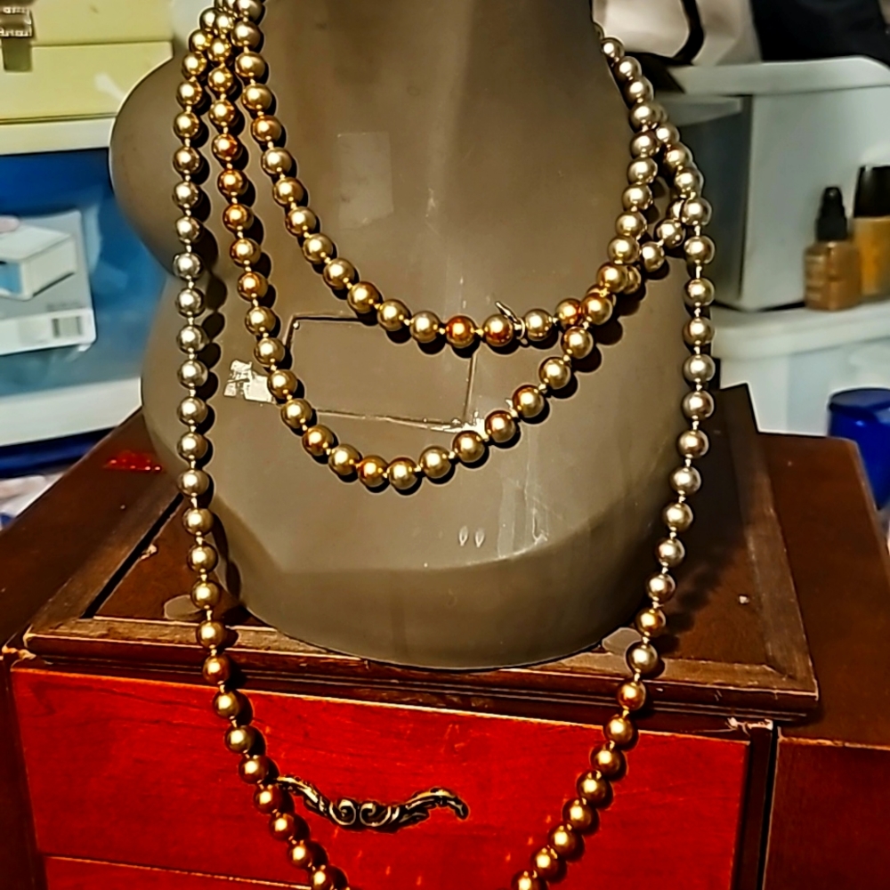 Carolee Faux Pearl Flapper Necklace . The necklace is 72", In Gold & Bronze Tone